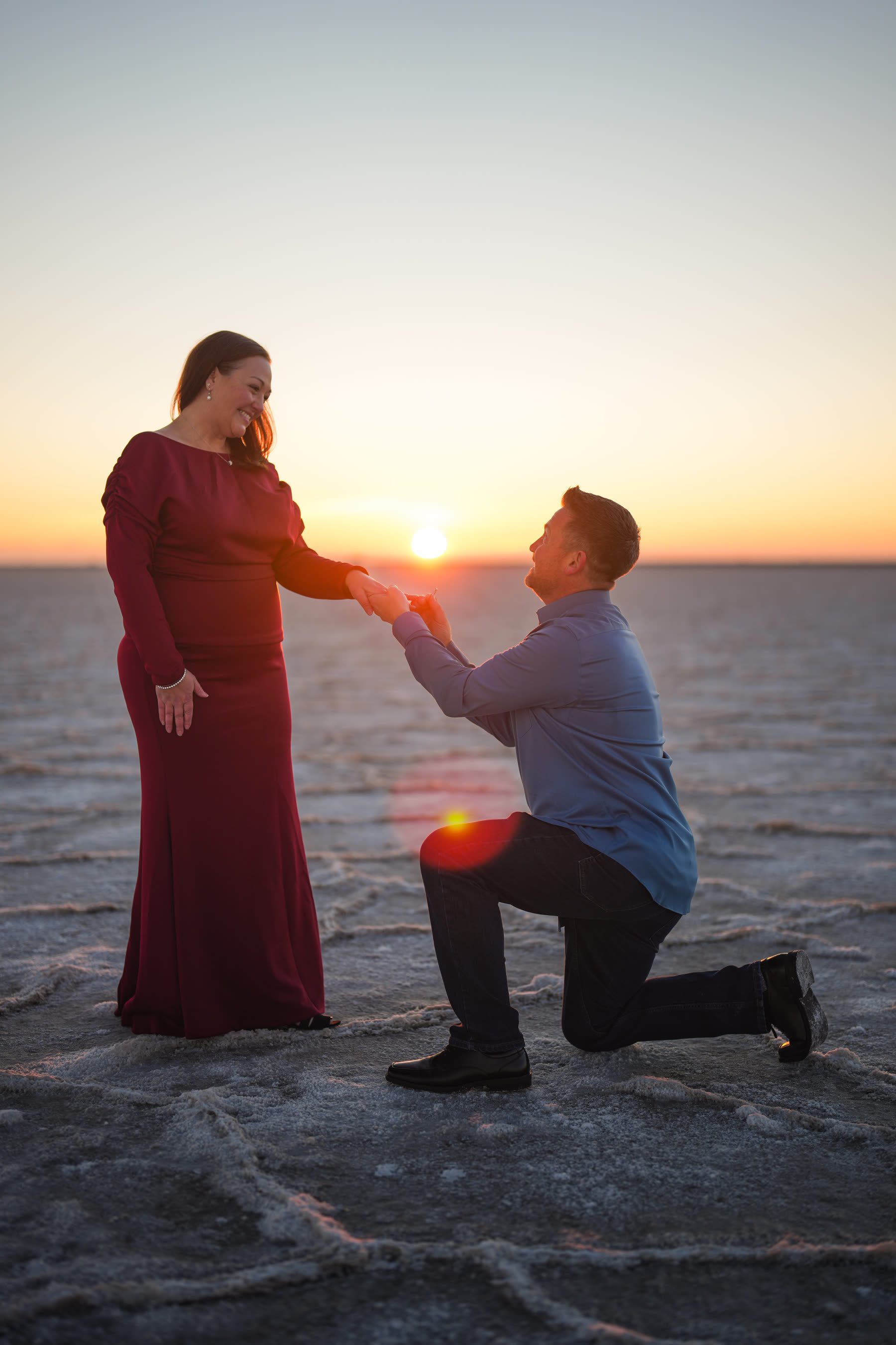 Proposal at golden hour on the shoreline